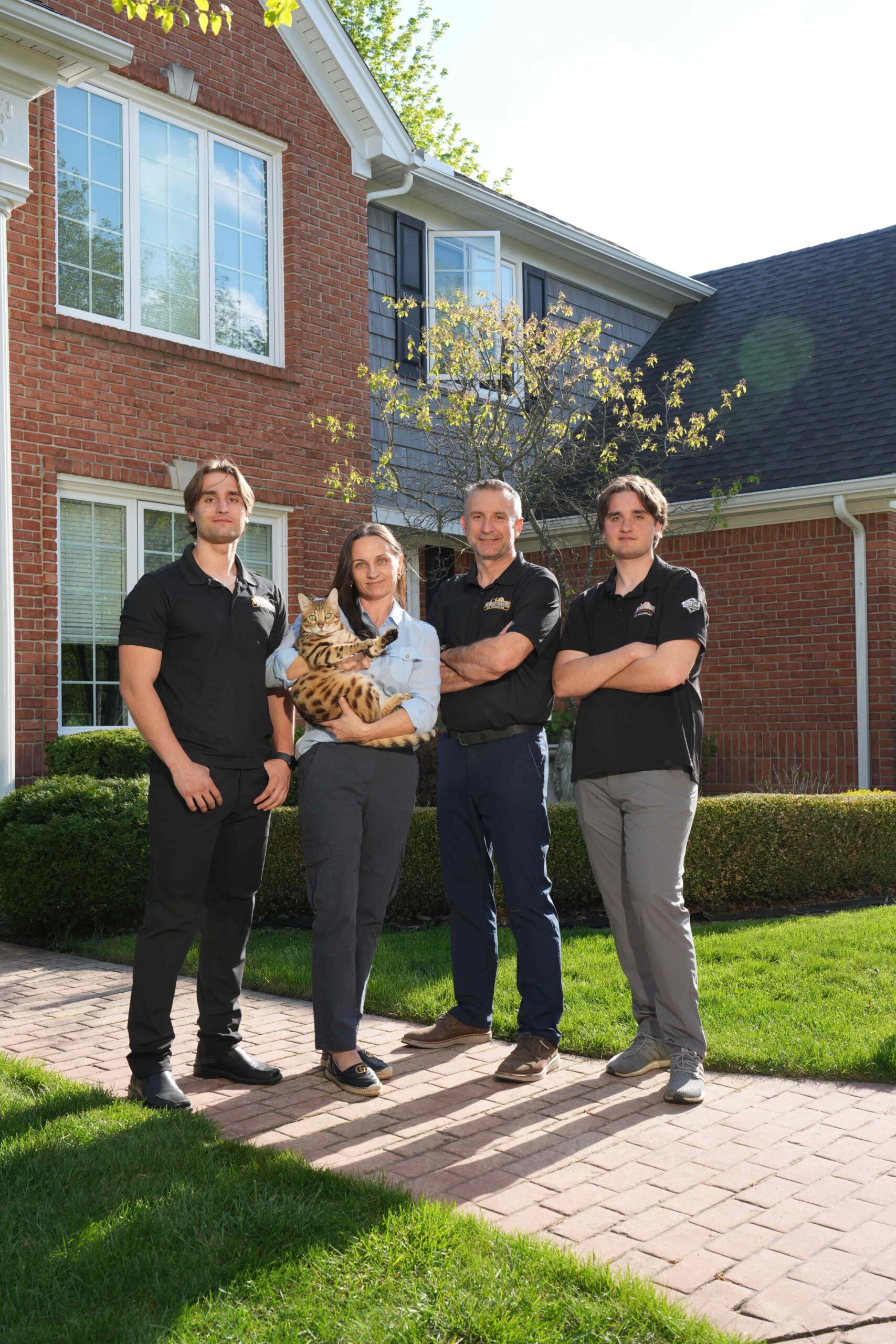 Owner of Home Exteriors of Michigan standing beside the company van